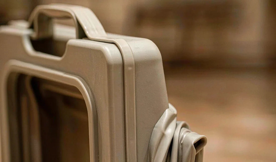 Close-up of the flexible fold section of a collapsible pet food container