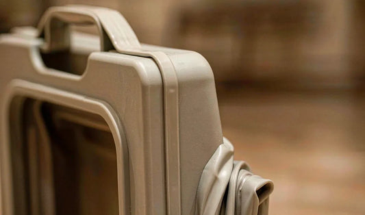 Close-up of the flexible fold section of a collapsible pet food container